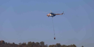 Ayvalık’ta makilik alanda çıkıp zeytinliklere sıçrayan yangın kontrol altına alındı