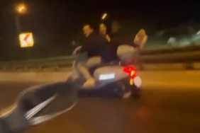 Motosikletin arkasında yatarak ilerledi, ölüme meydan okudu