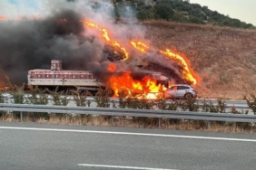 Alev topuna dönen araçtan yaralı kurtuldu