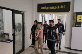 Suç makinesi kucağında bebekle tutuklandı