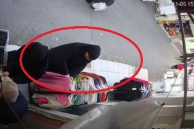 Kaşla göz arasında kıyafet çalan şüpheliler kamerada