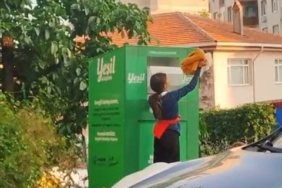 Canlarını hiçe sayarak giysi kumbarasından kıyafet çaldılar