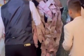 Bursa’da damadı paraya boğdular